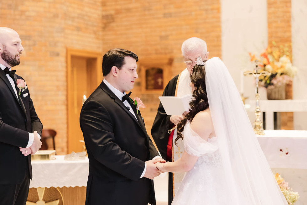 3. Groom holding bride’s hands while exchanging vows — emotional wedding ceremony photo in Richmond, VA.