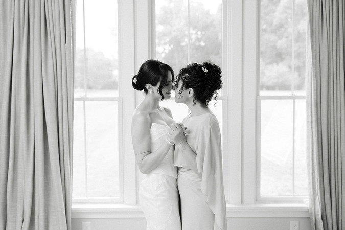 24. Emotional getting ready moment with bride and bridesmaid before a private residence wedding in Virginia