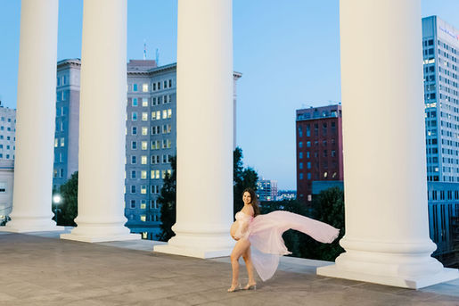 5. Dramatic maternity photo of mother in flowing pink dress at Virginia State Capitol Richmond Virginia