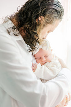 6. Richmond photographer capturing newborn baby feet close-up in soft natural light.