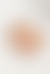 2. Close-up of baby Ben looking at camera in white onesie