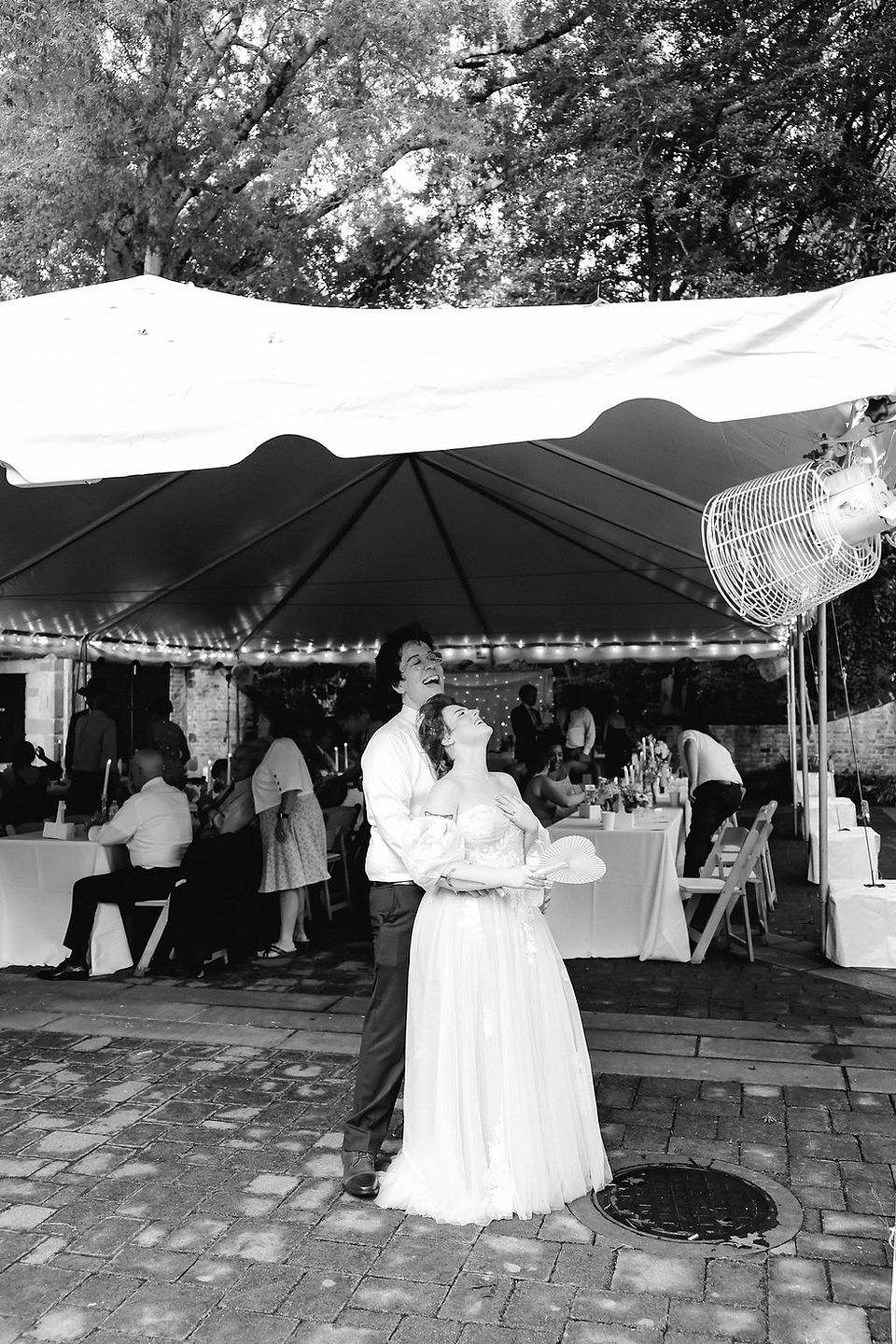 	11.	Bride and groom dancing together surrounded by guests