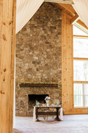 3. Fireplace mantle with rustic wedding decor in Virginia
