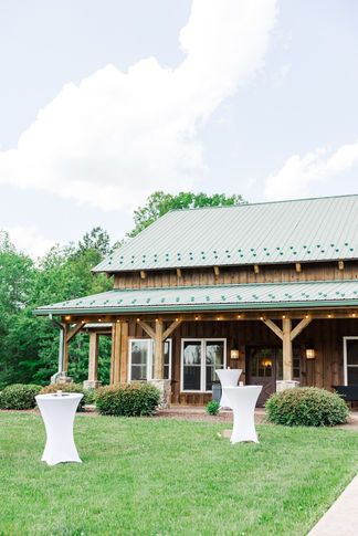 12. Cocktail hour setup outside barn at Timber Creek
