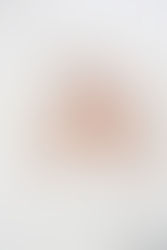 4. Richmond photographer capturing newborn baby smiling softly in white wrap.