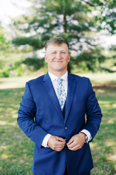 7. Groom smiling before spring wedding ceremony in Virginia countryside