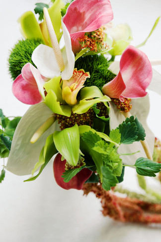 6. Close-up of colorful wedding bouquet with orchids, greenery, and red floral accents for a private residence wedding