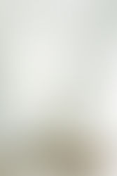 13. Wedding dress with bouquet on white chair in bridal suite