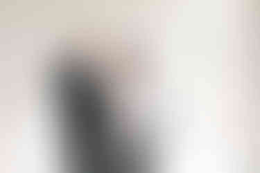 15. Final touches before the wedding as groomsman straightens groom’s tie — captured by Richmond wedding photographer.