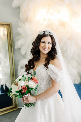 5. Bride standing in bridal suite with full gown and bouquet — elegant wedding morning moment in Richmond, VA.