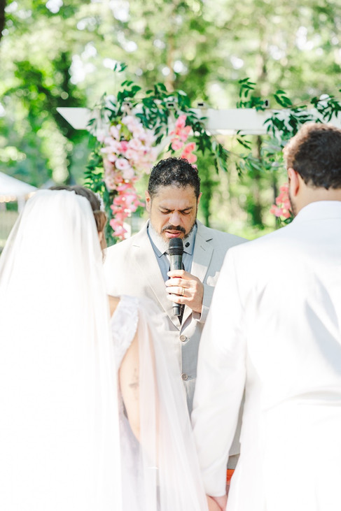 	12.	“Wedding officiant leading ceremony outdoors at The Virginia Cliffe Inn”
