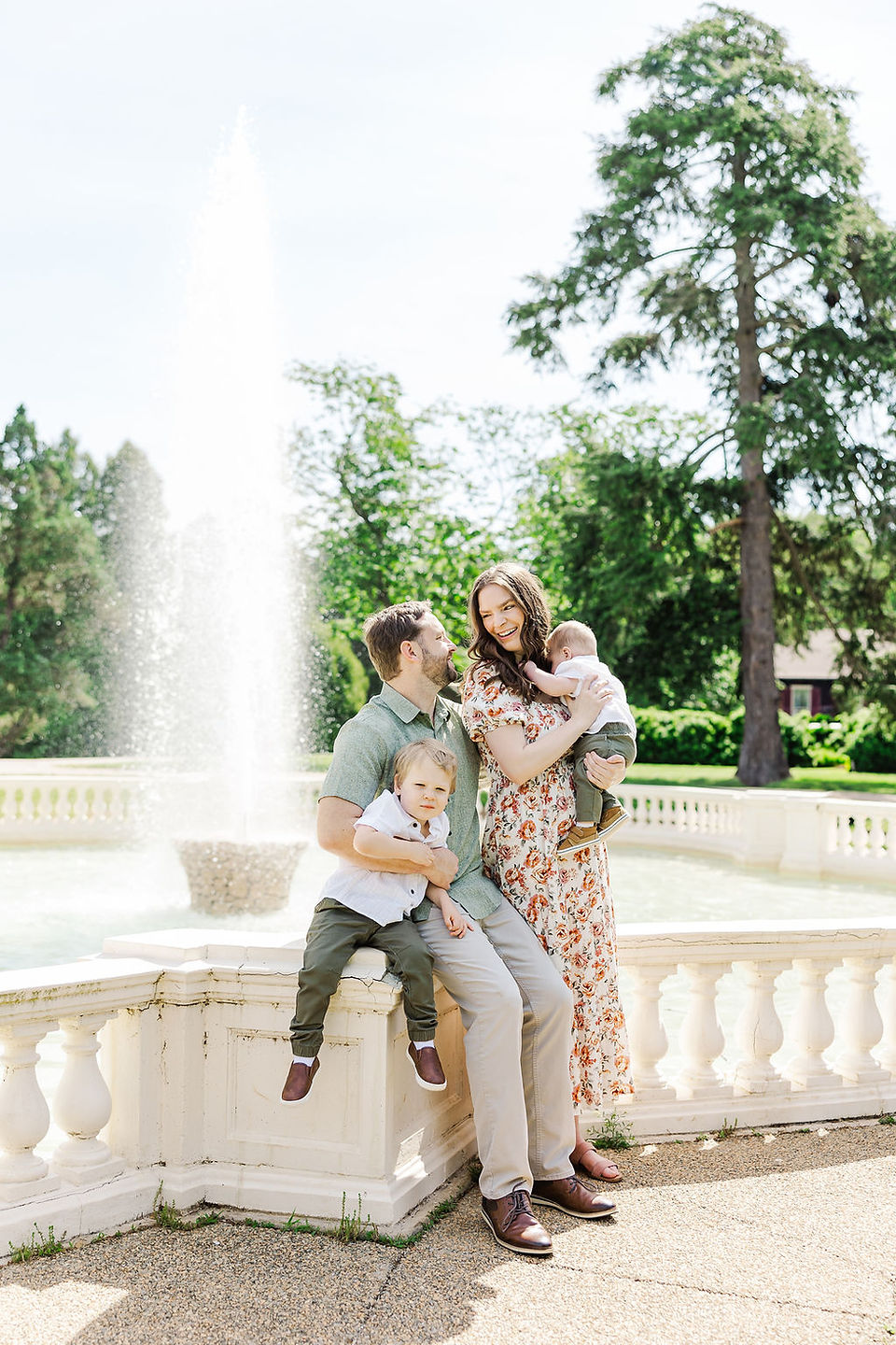 	11.	Family laughing and playing near Maymont fountain