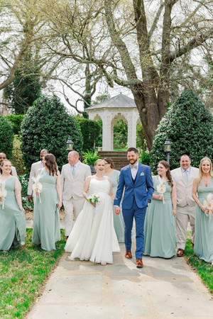 	3.	Bride and groom walking with wedding party outdoors