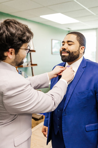 	8.	Groomsman helping groom with tie adjustment
