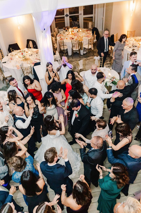 15️⃣ Crowd dancing with hands raised during wedding reception — joyful celebration at The Dominion Club in Richmond.