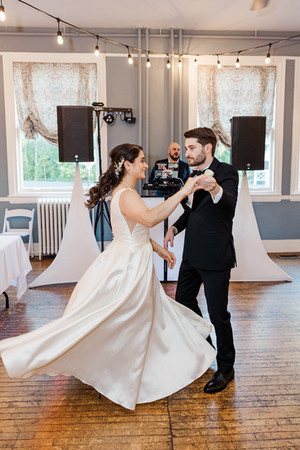 Bride and groom twirling on the dance floor during their first dance at The Schoolhouse at Hawthorne in Richmond, VA.