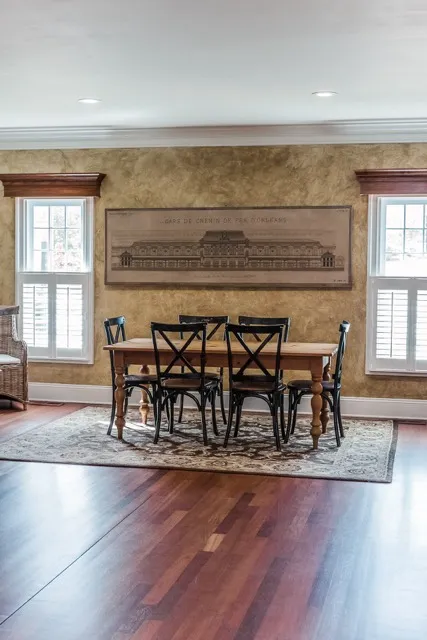 	16.	Rustic dining area with a long wooden table and elegant farmhouse-style decor at The Mill at Fine Creek.
