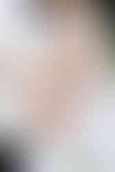 8. Close-up of bride and groom holding each other during their private residence wedding portraits