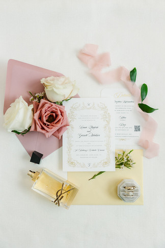 11. Wedding invitation flat lay with blush and ivory roses — elegant stationery details photographed in Richmond, VA.