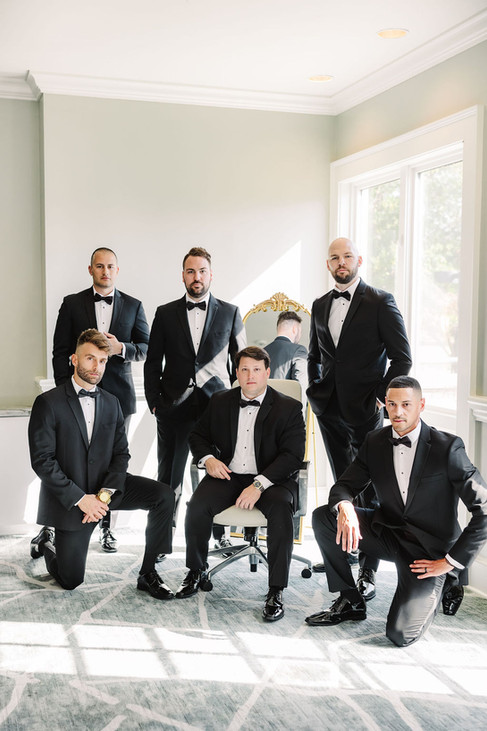 4. Groomsmen posing together in bright bridal suite — fine art Richmond wedding photography image.
