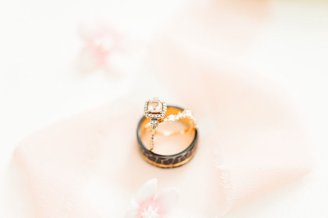 3. Engagement ring and wedding bands with soft blush tones