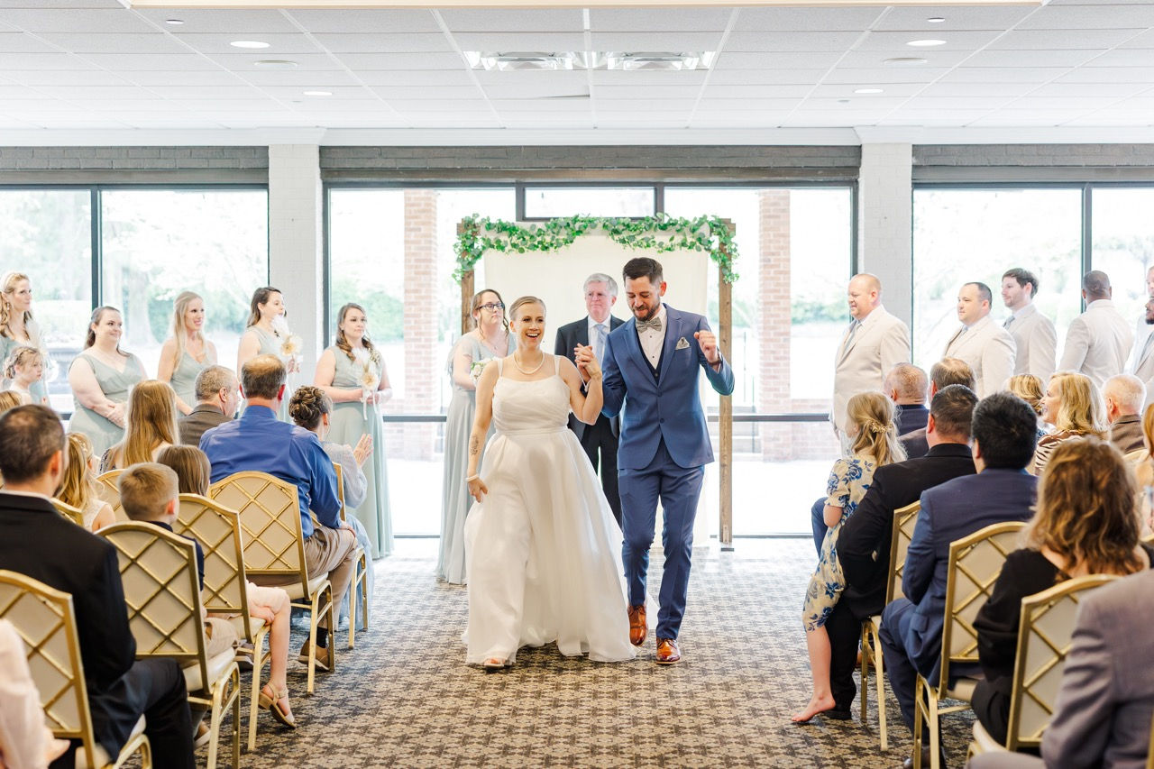 	16.	Bride and groom walking down the aisle together after ceremony