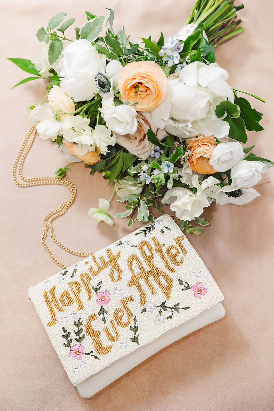 	14.	Bride’s bouquet and custom “Just Married” beaded purse with floral design
