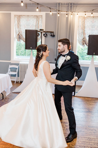 Bride and groom sharing their first dance in the reception hall at The Schoolhouse at Hawthorne in Richmond, VA.