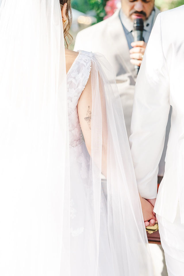 	13.	“Romantic close‑up of bride’s veil blowing in the breeze during Virginia outdoor wedding”