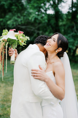 4. Bride and groom laughing together during outdoor portraits after their private residence wedding ceremony