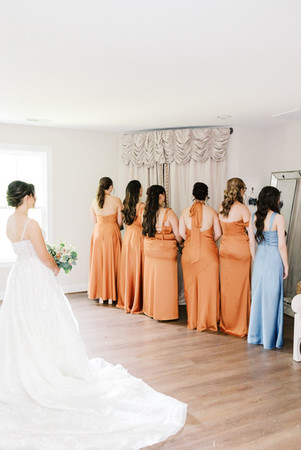 40. Bride with bridesmaids during first look before Richmond Virginia wedding