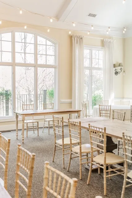 	8.	Elegant reception area with natural light and classic white decor, ready for a wedding celebration.