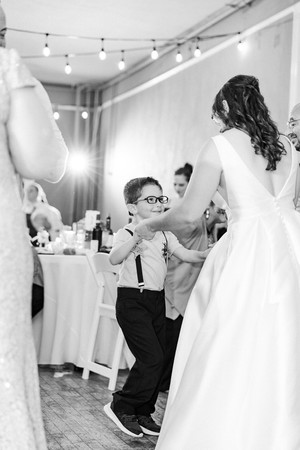Bride dancing with a kid in a wedding in Richmond VA
