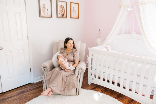 8. Richmond photographer capturing joyful parents with newborn in Virginia home.