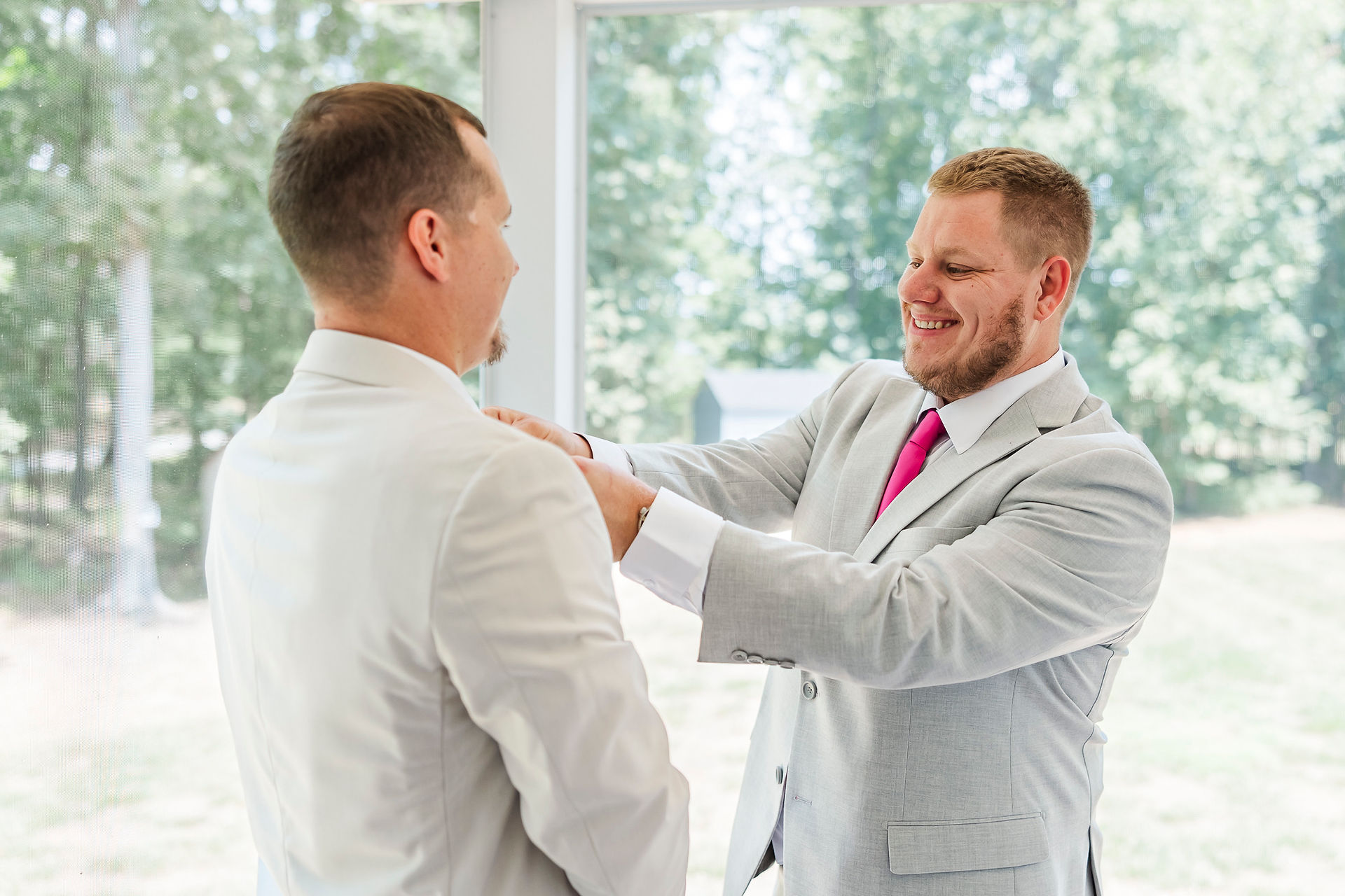 	6.	Best man adjusting groom’s jacket before the wedding ceremony.