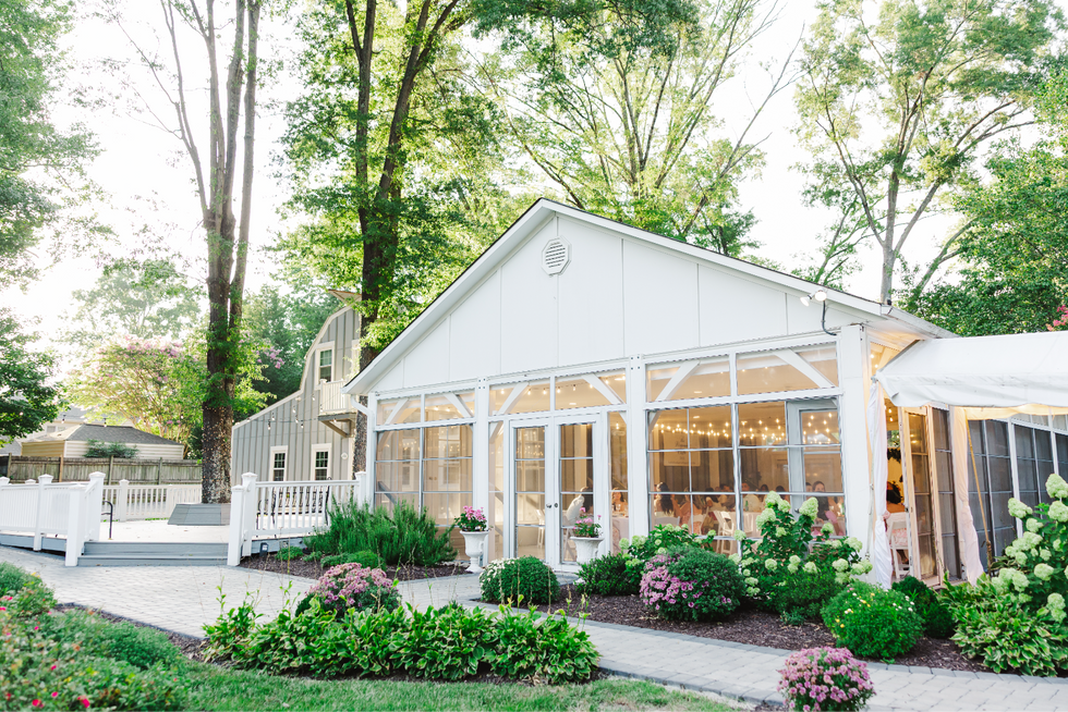 1. “Evening view of The Virginia Cliffe Inn reception pavilion surrounded by gardens”