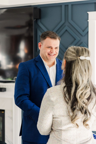 	9.	Groom smiling at the bride during a heartfelt winter wedding ceremony in Richmond