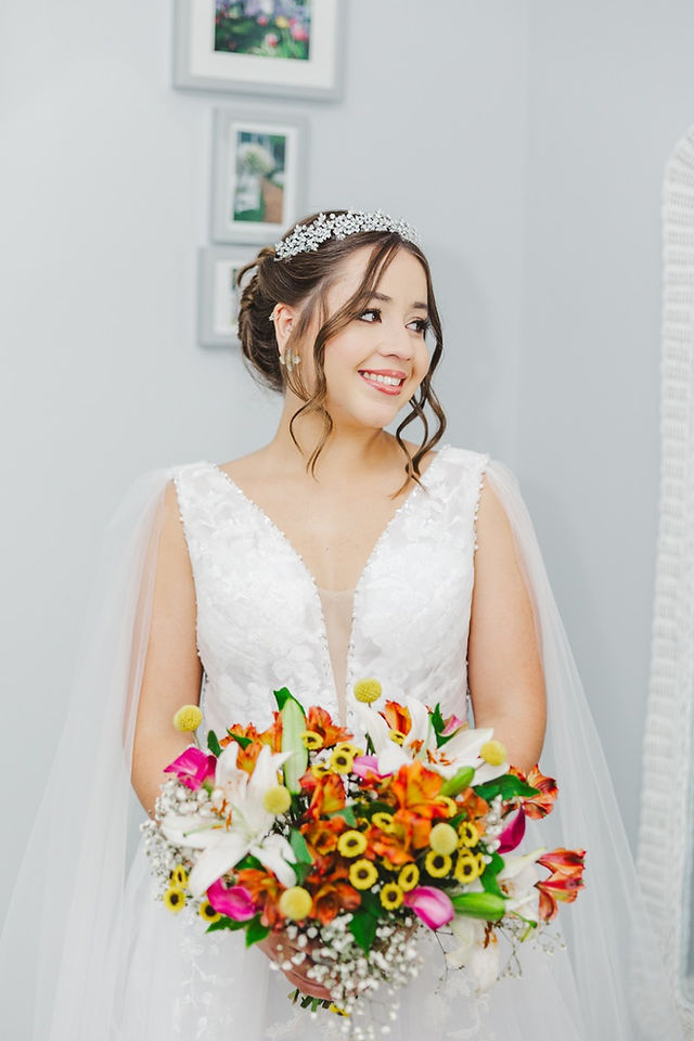 	5.	“Colorful summer bridal bouquet with heels styled at The Virginia Cliffe Inn bridal suite”