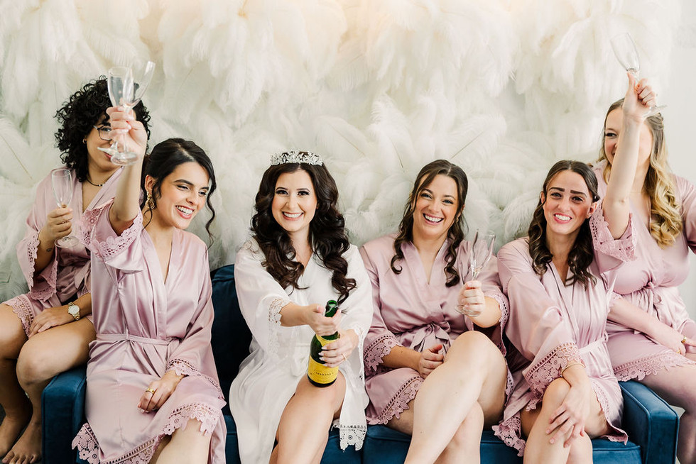 13. Bride and bridesmaids celebrating with champagne — fun getting ready moment captured in Richmond, VA.