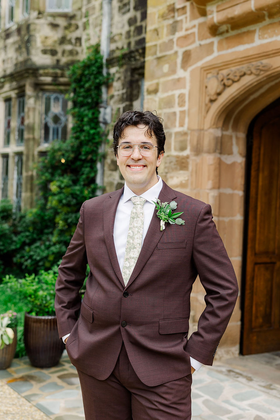 	14.	Groom portrait smiling in brown suit and boutonniere