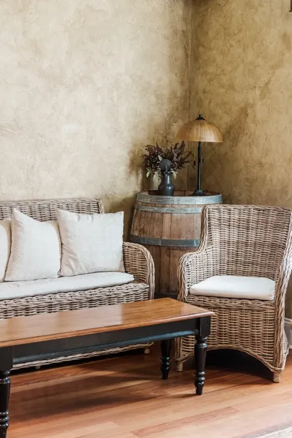	18.	Cozy seating area with neutral-toned furniture and soft lighting, perfect for wedding guests to relax.