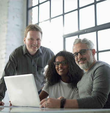 smiling-multiracial-coworkers-working-on