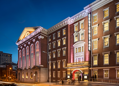 Baltimore Center Stage's front facade light up at night.