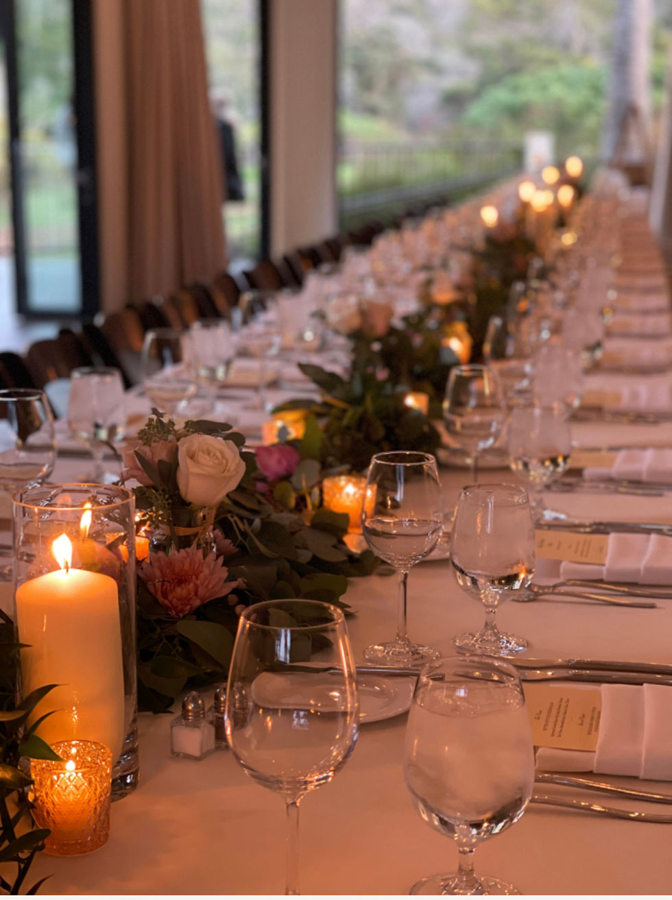 Table Floral Arrangement on a long table at a Wedding Dinner