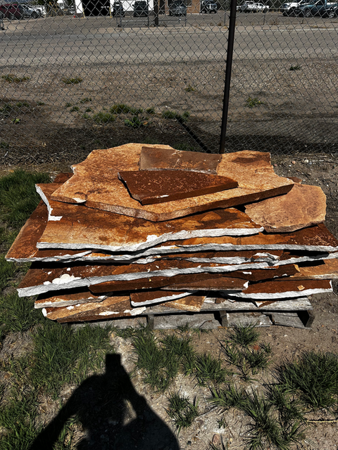Flagstone pavers featuring unique textures and natural color variations.