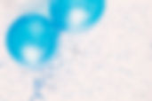 Studio shot of balloons on colored spott