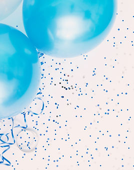 Studio shot of balloons on colored spott