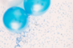 Studio shot of balloons on colored spotted background