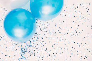 Studio shot of balloons on colored spotted background