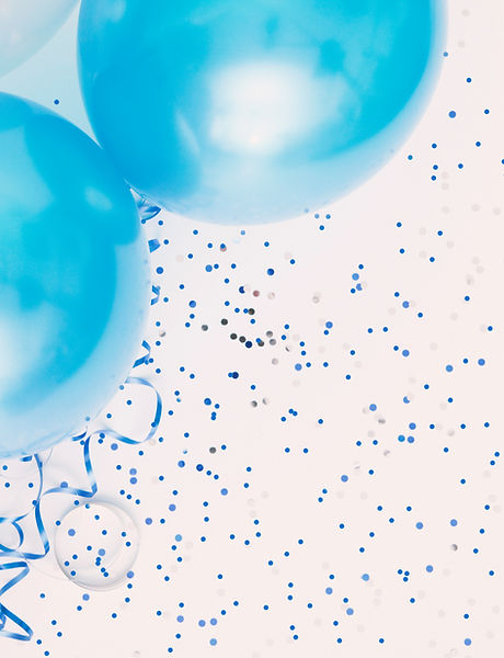 Studio shot of balloons on colored spotted background